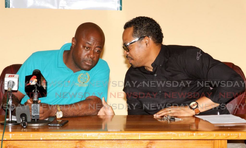 NOT LIKE THIS: POA president Ceron Richards, left, and general secretary Lester Walcott fail to adhere to social distancing rules during a press conference on Thursday at the POA head-office in Arouca. PHOTO BY ANGELO MARCELLE - Angelo Marcelle