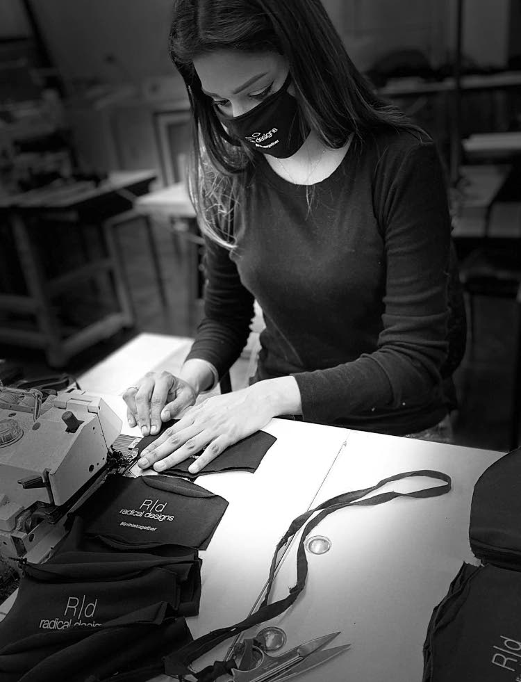
A Radical Designs seamstress sews face masks under the brand's name for use in the fight against covid19. Photo: Radical Designs/Facebook - 