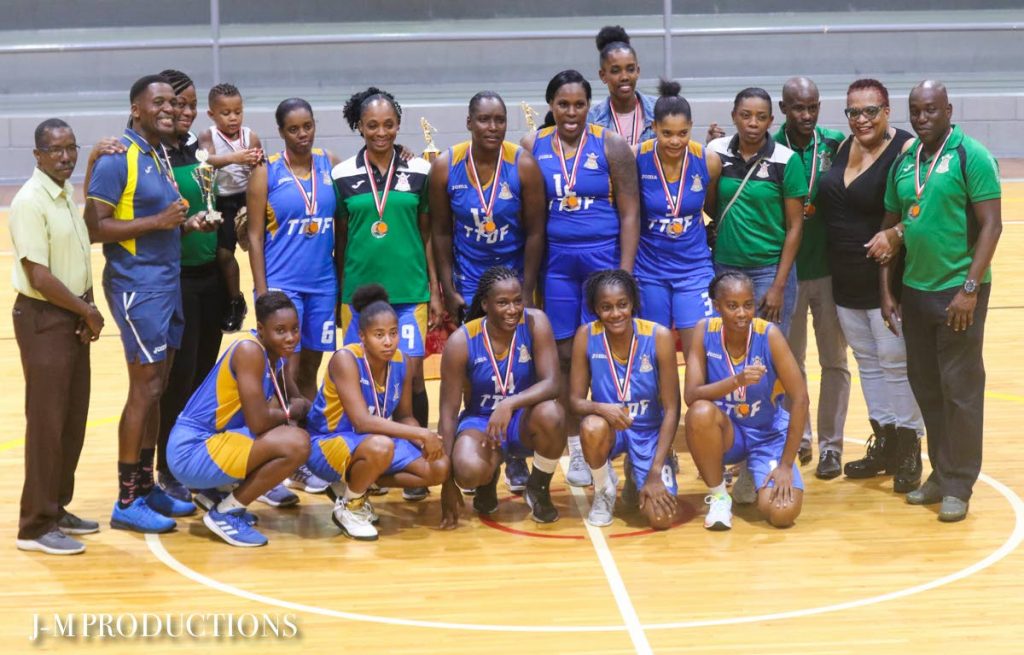Victorious players and officials of the Defence Force women’s basketball team. PHOTO COURTESY SEAN MORRISON - 