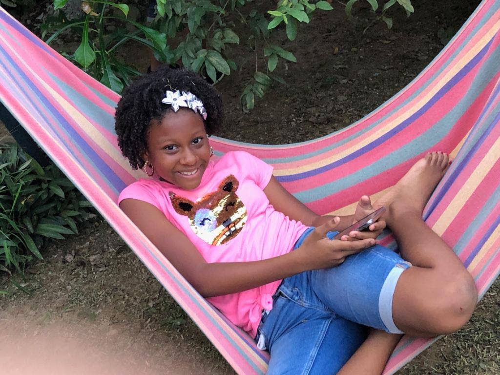 Janya Harrington relaxes at home. In an essay, Janya, who goes to The Athenian Presecondary School, writes about how her life has changed because of covid19. - 