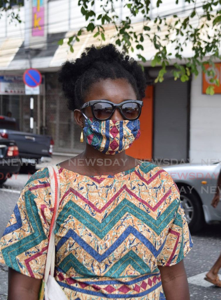 A woman walks around in Port of Spain wearing a homemade face mask. PHOTO BY VIDYA THURAB - Vidya Thurab