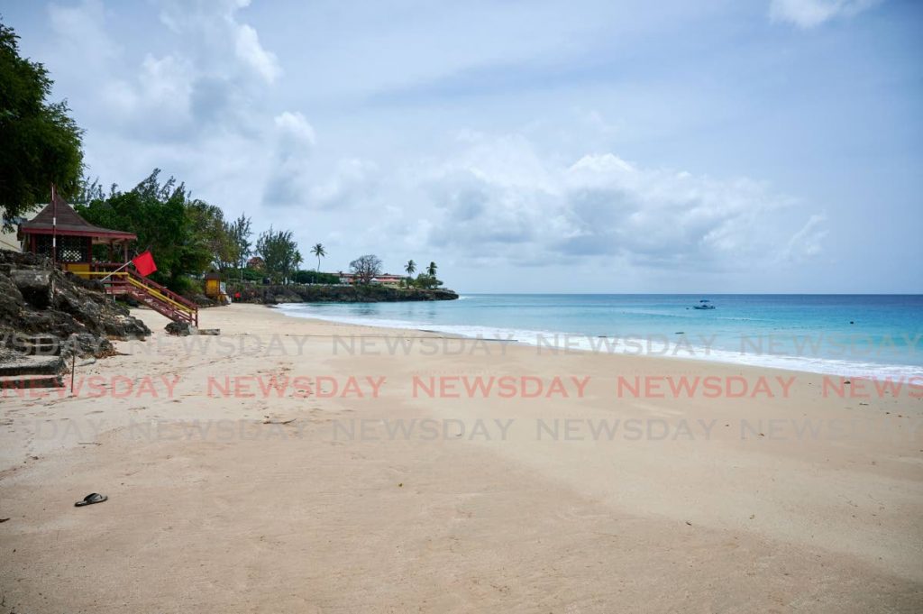 DESERTED: Store Bay beach, which is usually filled to capacity during the long Easter weekend, was quite tranquil on Good Friday.  PHOTO BY LEEANDRO NORAY - LEEANDRO NORAY