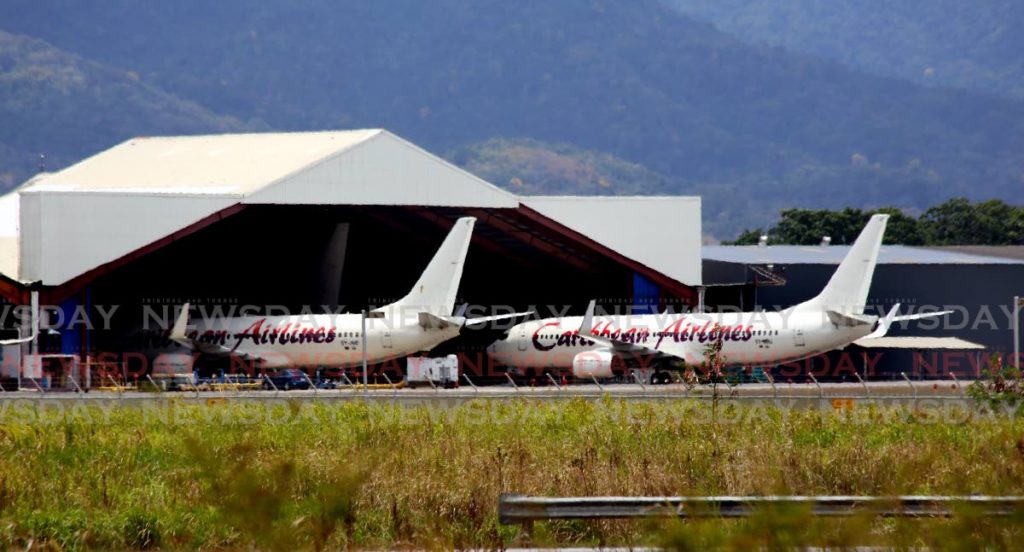  Caribbean Airlines planes in their hangar at Piarco International Airport. Photo by Sureash Cholai

