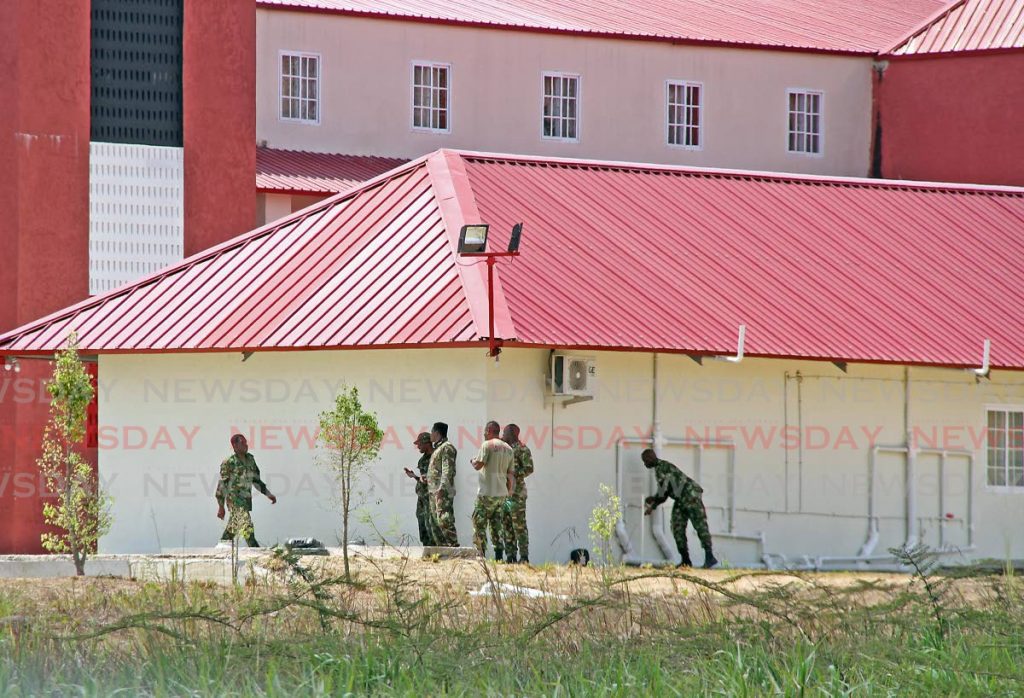Soldiers seen on the compound of the Home of Football in Couva on Saturday. This is one of the facilities to be used for recovering covid19 patients. - Vashti Singh