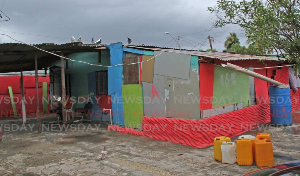 Anthony Grant and his family live in this brightly coloured makeshift home in Chaguanas. - Vashti Singh