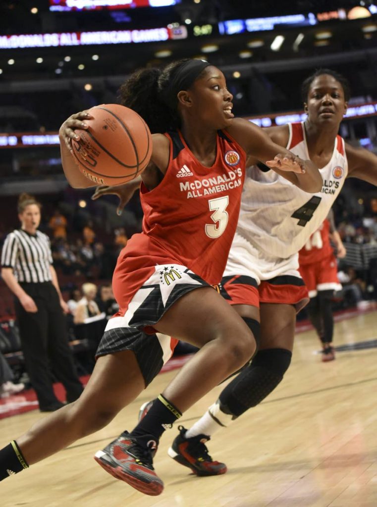 In this March 30, 2016 file photo, Kaila Charles (L) of the East team drives on Nadia Fingall  of the West team during the 2016 McDonalds’s All American Game at the United Center in Chicago, Illinois. (AFP PHOTO) - 