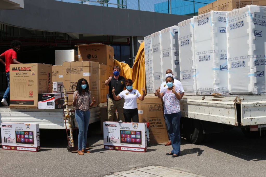 HELPING HANDS: From left, Alana Lewis, Disaster Preparedness Coordinator (ERHA); Robert Baur, Group Marketing Manager at ASSL; Pamela Hosein, CEO of ASSL, Curtis Cummings, COO at ASSL and Dr Allana Best, Medical Officer of Health, St Andrew and St David with some of the appliances donated to the Health Ministry by Amalgamated Security Services Ltd (ASSL) on Saturday. PHOTO COURTESY ASSL - ASSL