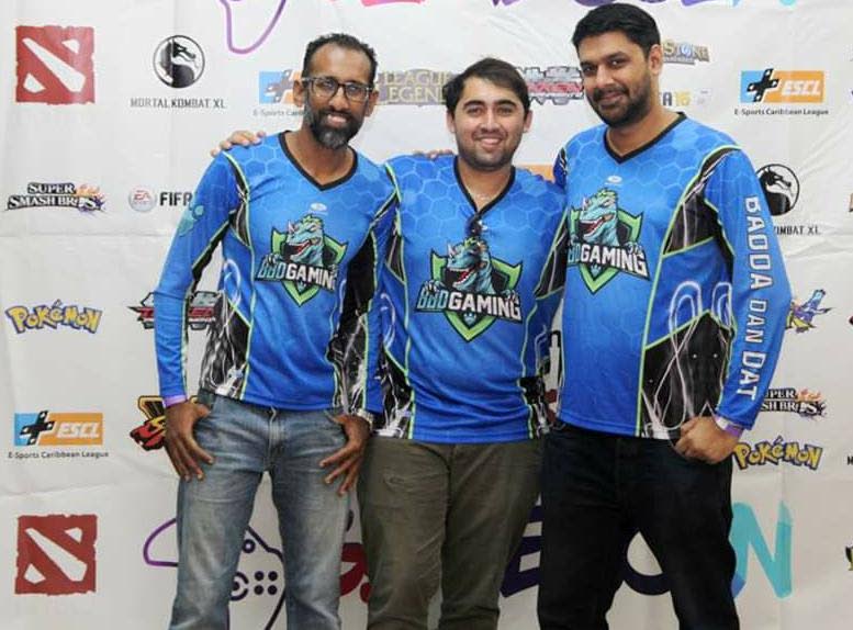 Kevin Jhinoo of BdD Gaming, left, with BdD supporters  Avery Sirju, middle, and Timothy Charran.   - 