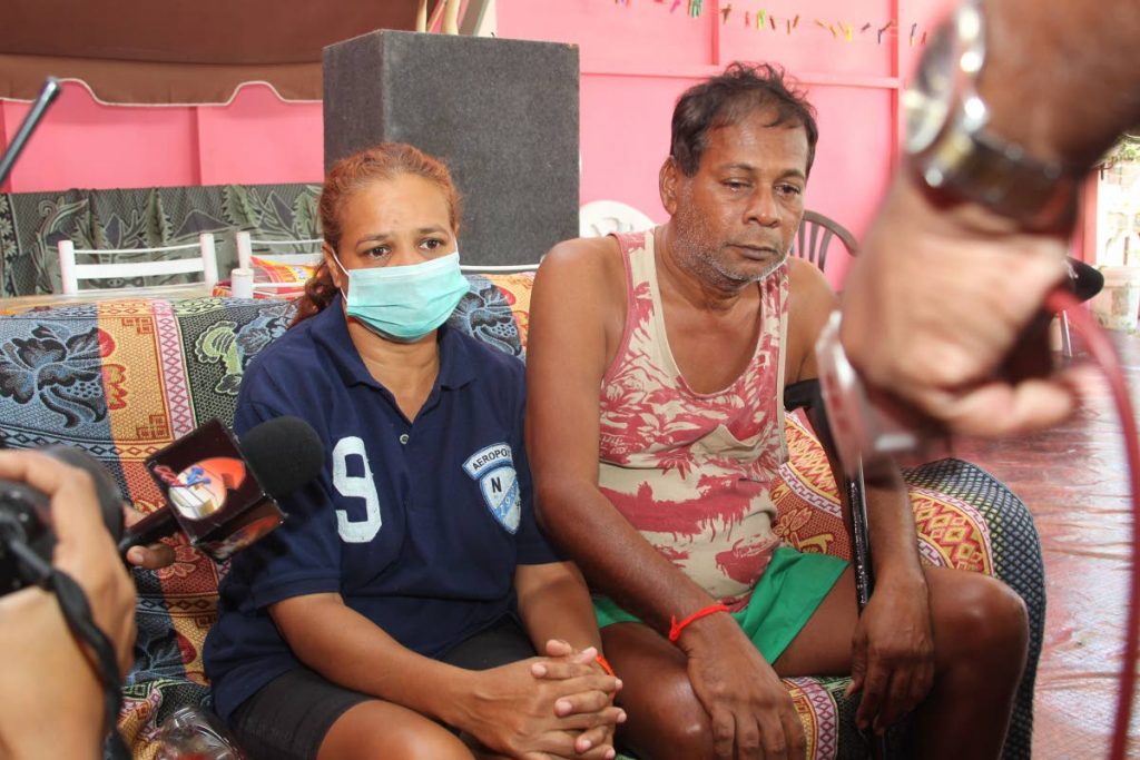 SORROW: Tony and Ann Chitbahal speak with reporters on Thursday hours after gunmen invaded the house in Couva and murdered the couple’s daughter and son. PHOTO BY LINCOLN HOLDER - L Holder