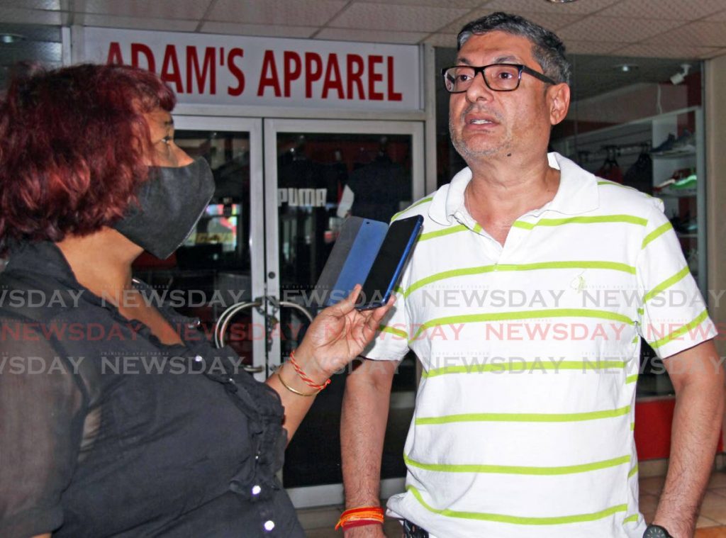Newsday reporter Seeta Persad, left, interviews President of the San Fernando Greater Area Chamber of Commerce Kiran Singh about reduced business activity in the southern city on Friday. - Vashti Singh