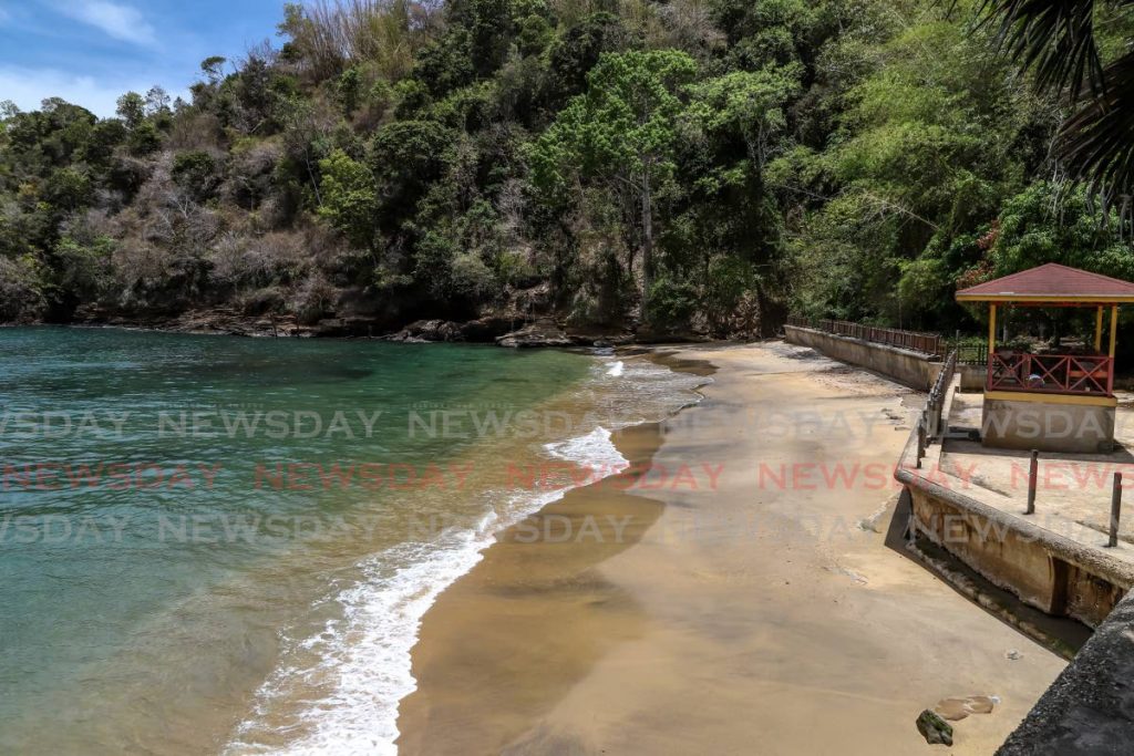 The water meets the sand at a deserted Macqueripe Beach, Chaguaramas, last Friday. - JEFF K MAYERS