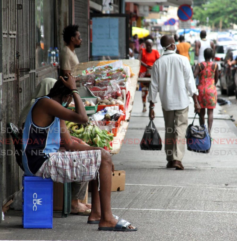 Illegal Vending: Street vendors ply their trade along Broadway in Port of Spain, despite covid19 regulations banning such activities. - Angelo Marcelle