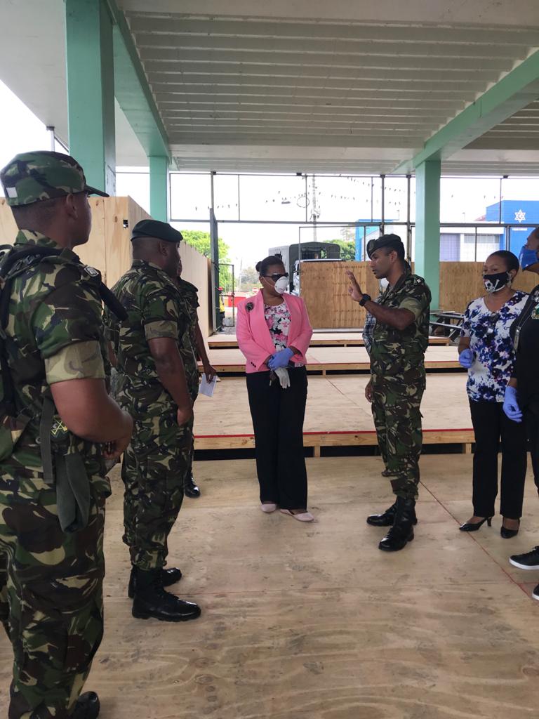 Permanent Secretary Jacinta Bailey-Sobers (center) and staff from the Ministry’s Social Displacement Unit join the Trinidad and Tobago Defense Force for a walk-through on April 7th. Photo courtesy Ministry of Social Development.