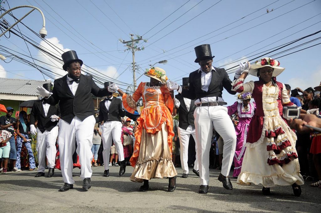 Participants dance during the street procession at the Moriah’s Ole Time Wedding production for 2018 Tobago Heritage Festival. - 