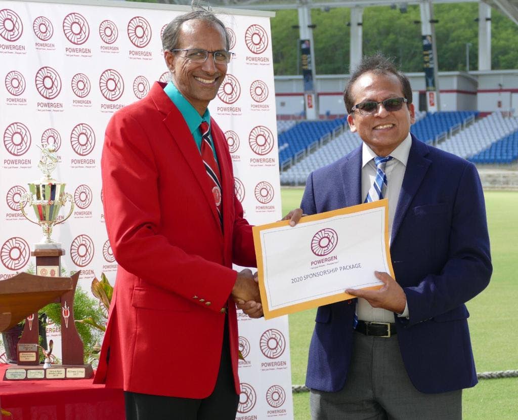 General manager of PowerGen Surindranath Ramsingh, right, presents a sponsorship package to president of the SSCL Surujdath Mahabir at a function earlier this year. PHOTO COURTESY SSCL - SSCL