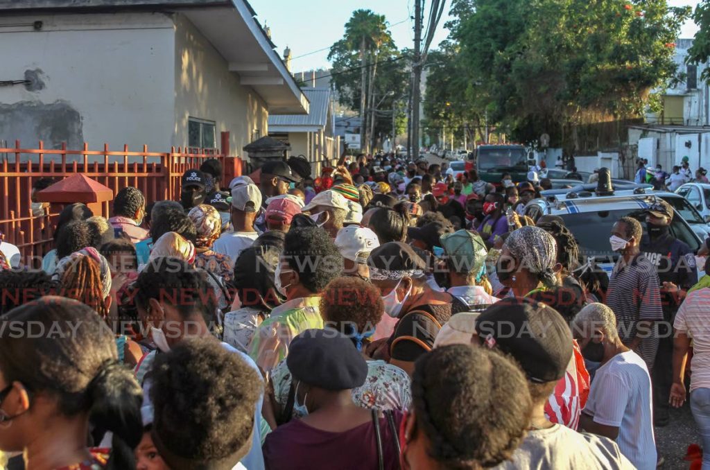 Hundreds of people who gathered outside the Living Water Community on Friday waiting for hampers had to be turned away by police as they breached social distancing regulations. - Ayanna Kinsale