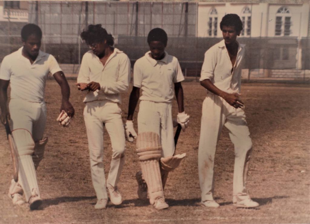 Lara (second from right) and fellow batsman Sheldon Anthony (left) walk off the field during a game at the Fatima Ground, Mucurapo. PHOTO COURTESY RONALD DANIEL. - 