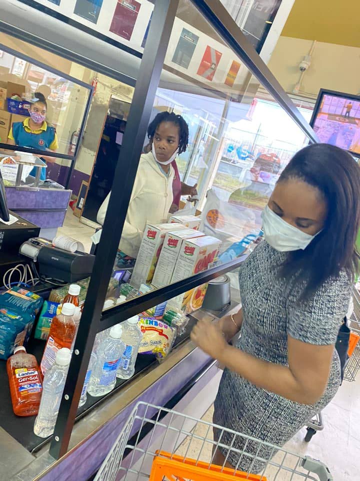 Tobago West MP Shamfa Cudjoe, right, at Penny Savers supermarket last week to get items to distribute to her constituents. Penny Savers provided assistance to the MP. PHOTO COURTESY Shamfa Cudjoe Facebook page  - 