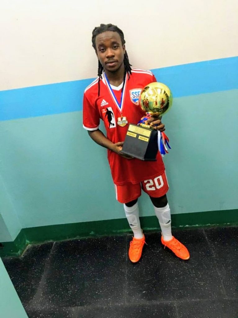 Ronaldo Jacob, poses with a trophy he won for being the player of a match after his North-South Classic football tournament at the Manny-Ramjohn stadium.  


PHOTO COURTESY RONALDO JACOB - RONALDO JACOB