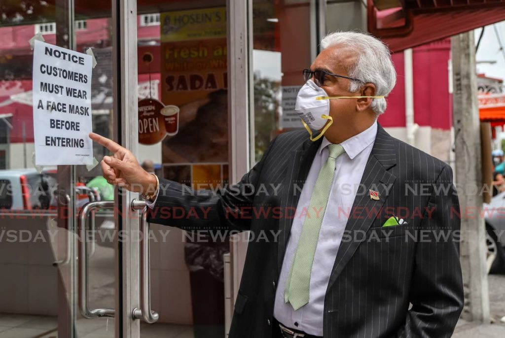 FILE PHOTO: Minister of Health Terrence Deyalsingh was pleased to see a sign that refuses entry without mask, while doing visits to food businesses in Port of Spain on May 12. - JEFF K MAYERS