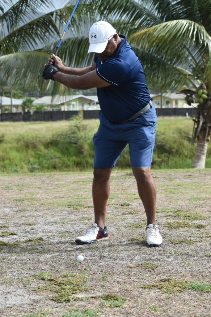 Amateur golfer Philroy Phillip practises his swing for the first time in several weeks, on Tuesday, at the Millennium Lakes Golf and Country Club, Trincity as stay at home measures that were implemented because of the covid19 pandemic began to ease since Monday. - Sherdon Pierre