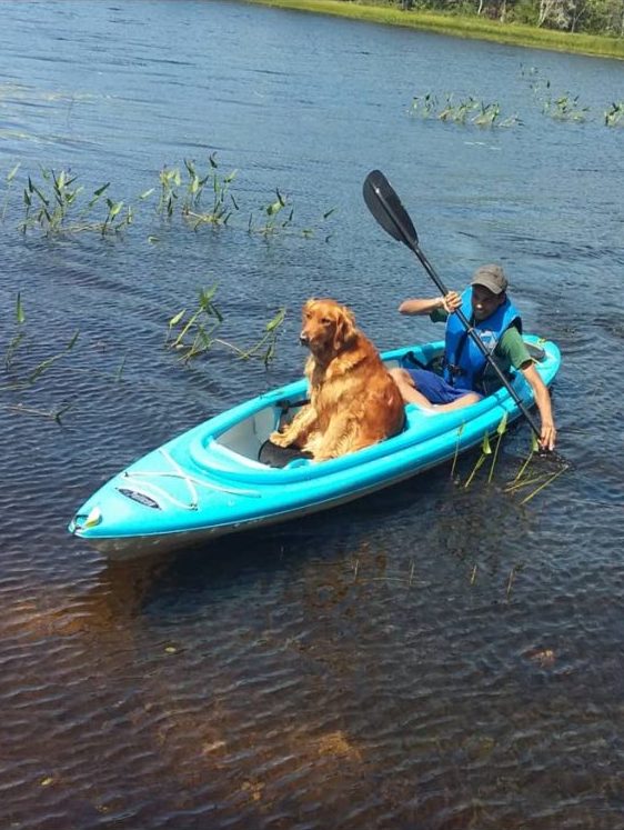 Captured by hobbyist photographer of my son kayaking  in a pond with his dog Russell - Jaishima Pariag