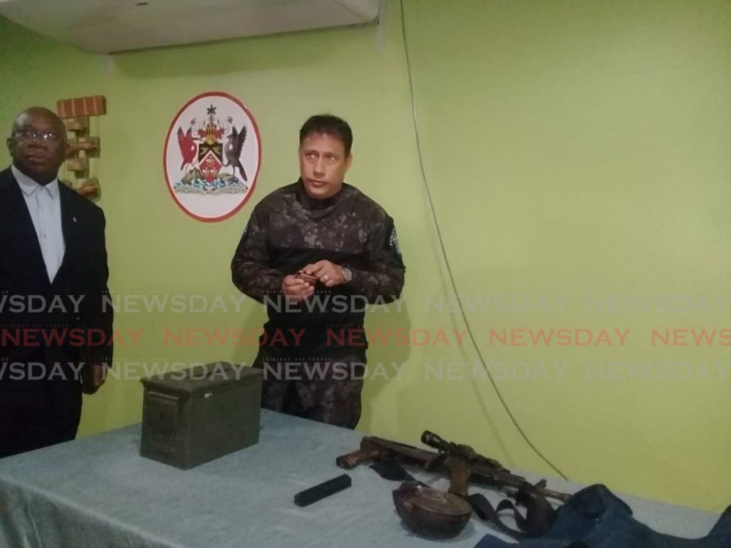 Police Commissioner Gary Griffith shows a magazine containing 5.56 caliber rounds of ammunition seized from the home of Nigel “Dufu” Mayers in Morvant on Thursday.  - Shane Superville