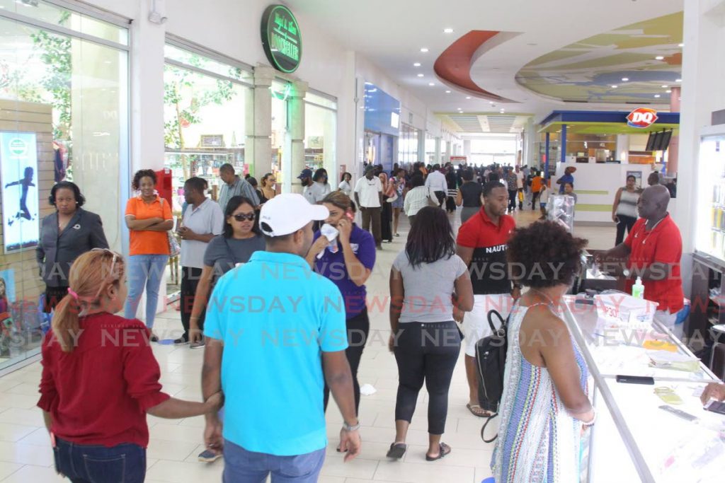 Shoppers at the a cosmetic store at Trinicty Mall on March 26. - Sureash Cholai