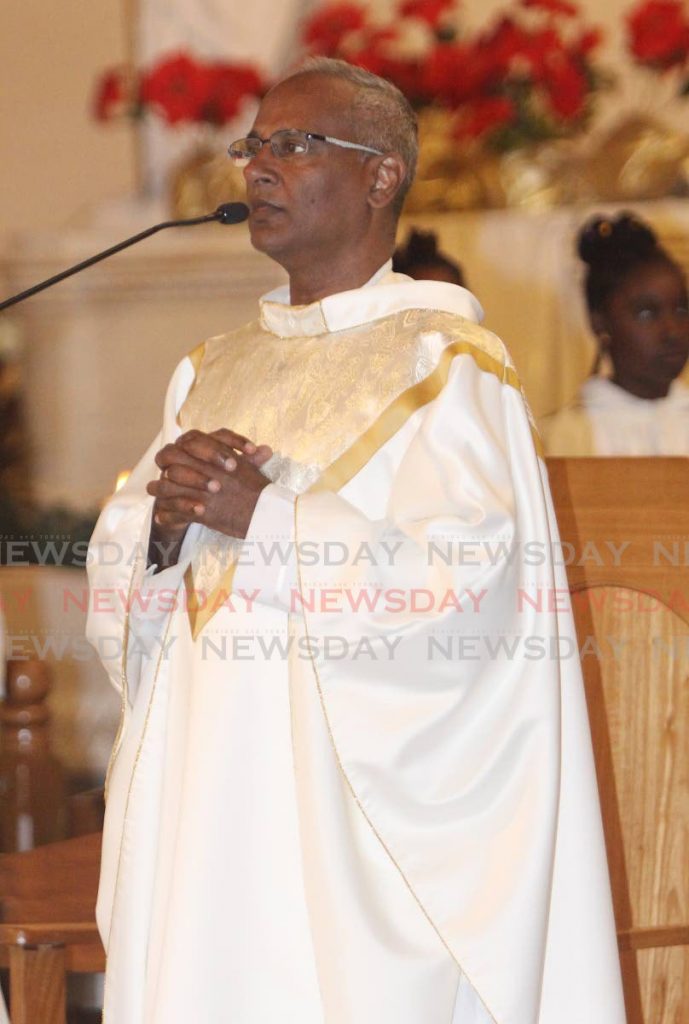 Fr Martin Sirju during mass at the Cathedral of the Immaculate
Conception, Port of Spain. PHOTO BY ANGELO MARCELLE - 