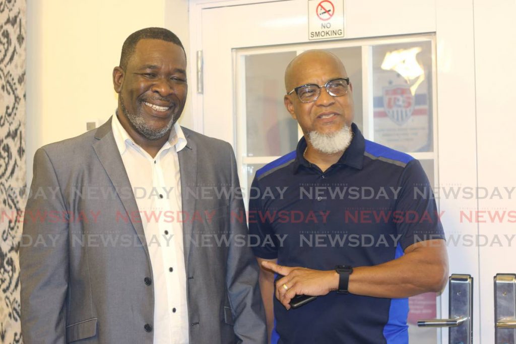 In this Nov 24, 2019 file photo, United TTFA member Keith Look Loy (right) shares a light moment with William Wallace after the latter was elected president of the TT 
Football Association, at the FA’s elections, held at the Home of Football, Couva.  - Marvin Hamilton