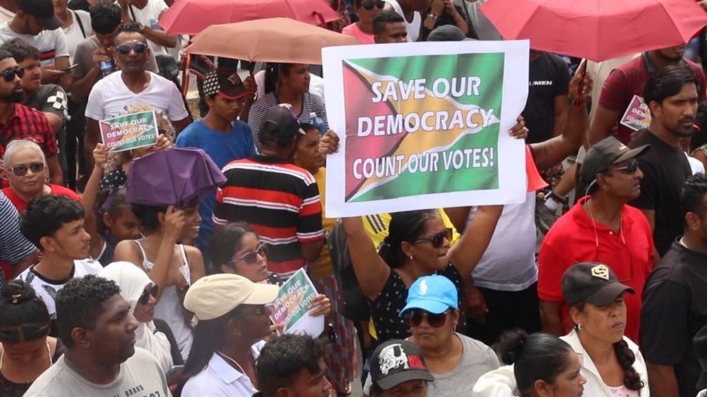 File: Guyanese protest alleged irregularities in the counting of votes by the Guyana Elections Commission which has resulted in an injuction stopping GECOM from announcing results of the March 2 elections.  - 
