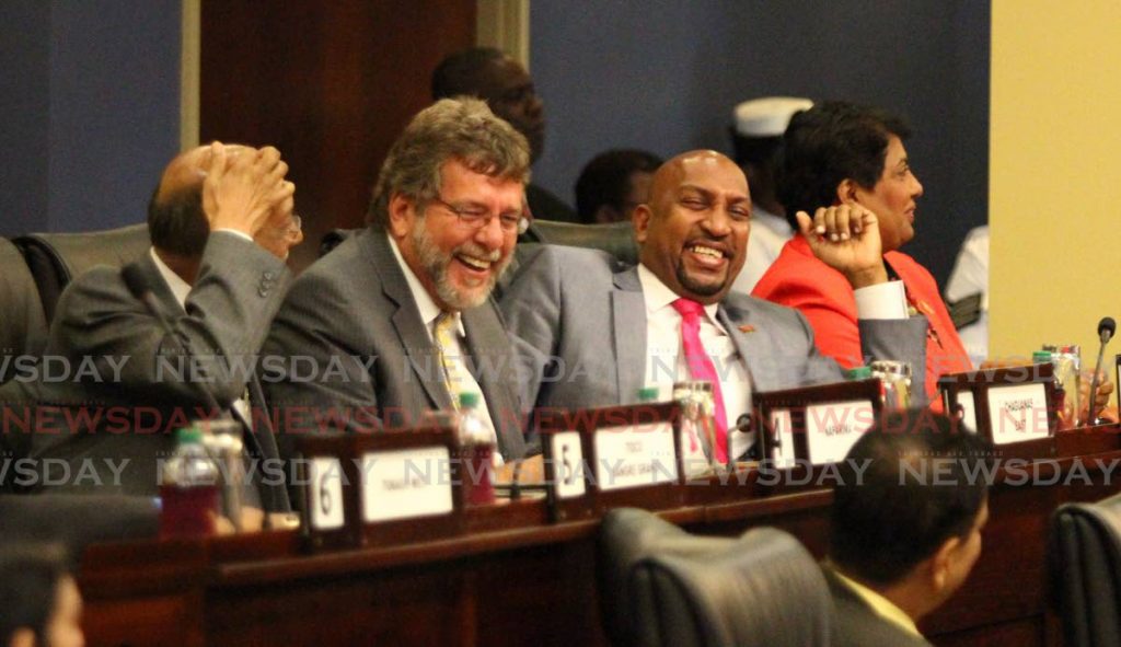 In this September 27, 2013 file photo, sports minister and D'Abadie/O'meara MP Anil Roberts, centre, and MPs Nizam Baksh, left, and Stephen Cadiz are in good spirits during a Parliament sitting. Police are once more investigating the $400 million Life Sport programme which fell under Roberts during the People's Partnership administration. - 
