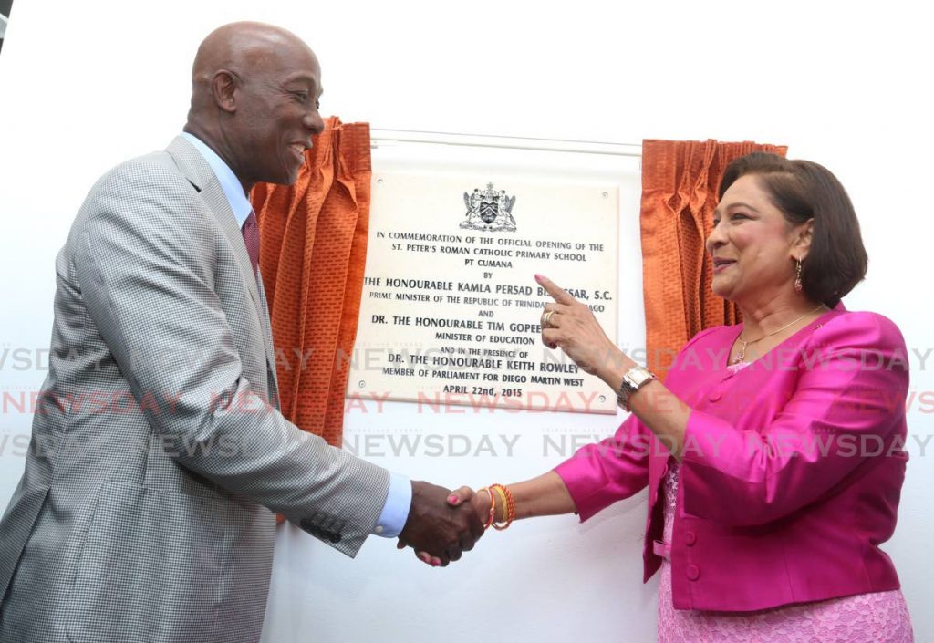 I'M WATCHING YOU: Then prime minister Kamla Persad-Bissessar and then opposition leader Dr Keith Rowley open the St Peter's RC Primary School in Pt Cumana in April, 2015. FILE PHOTO - 