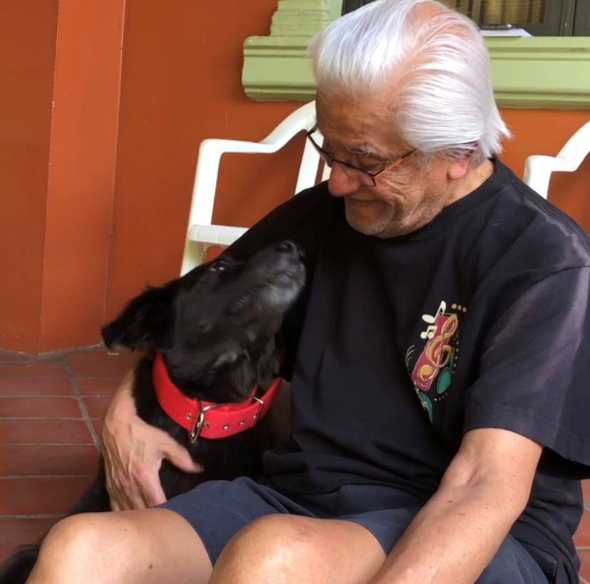 Founder and former leader of the UNC Basdeo Panday and his dog Norman share a friendly smile during a recent photo posed on his Facebook page. - 