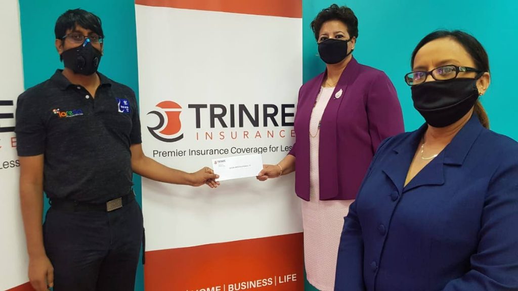 President of Sewa International TT, Revan Teelucksing, left,  receives a donation from Trinre representatives, Lelia Compton, center and Aneesa Ali-Khan. - 