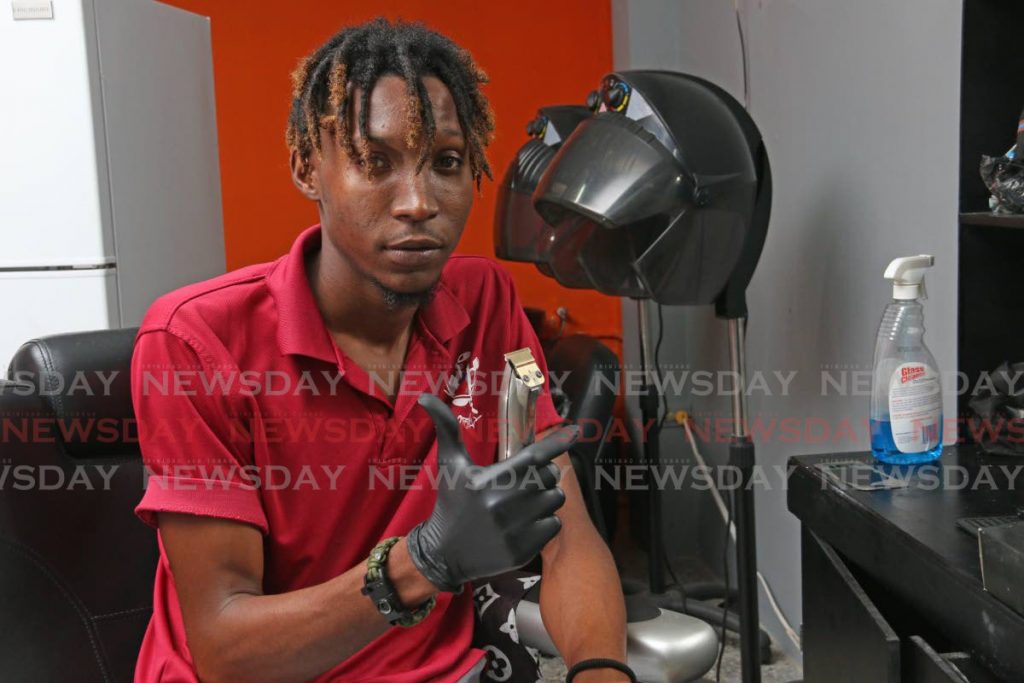 Kareem Trent Alexander, a barber at KDB Anoited Cuts, said he sanitised the equipment at his barbershop in La Romaine. - 