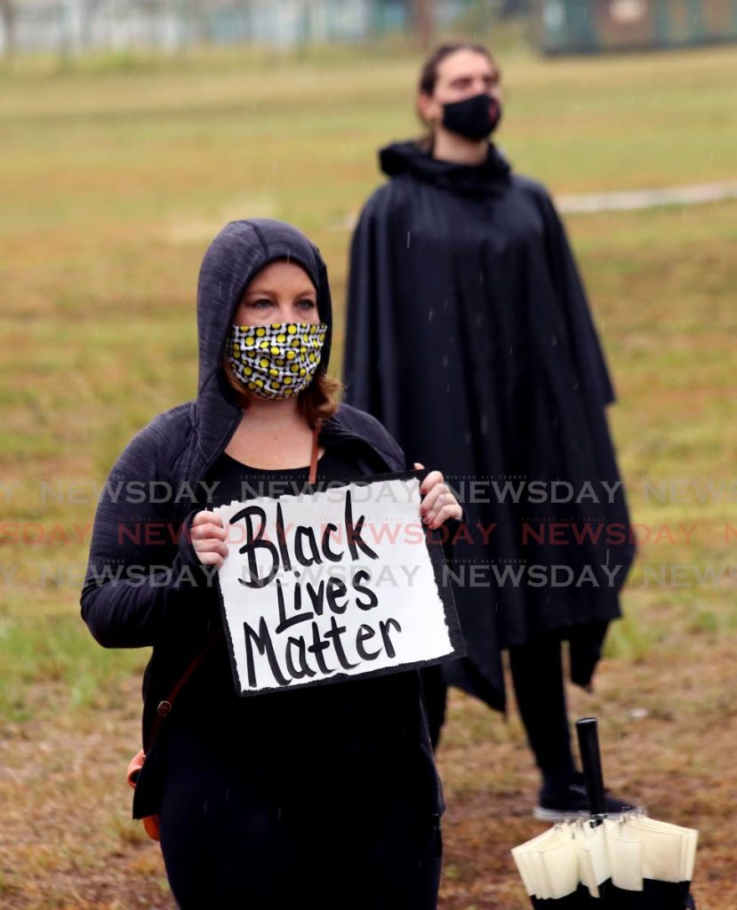 In this June 4 file photo two of the protestors who stood opposite the US Embassy in Port of Spain on Friday as part of the Black Lives Matter demonstration. - SUREASH CHOLAI