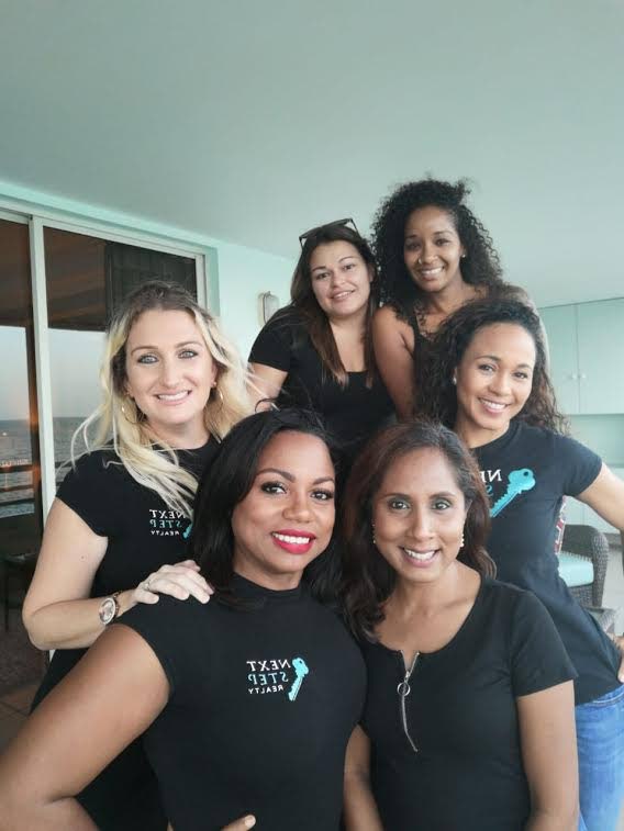 The Next Step Realty team from left are agents and company directors, Leia Jardim-Lue and Jamiyla Narinesingh, with agents Dariela Govia, Tricia Dookie (front right), Jamie Romeo and Teri Leigh Bovell.  - 