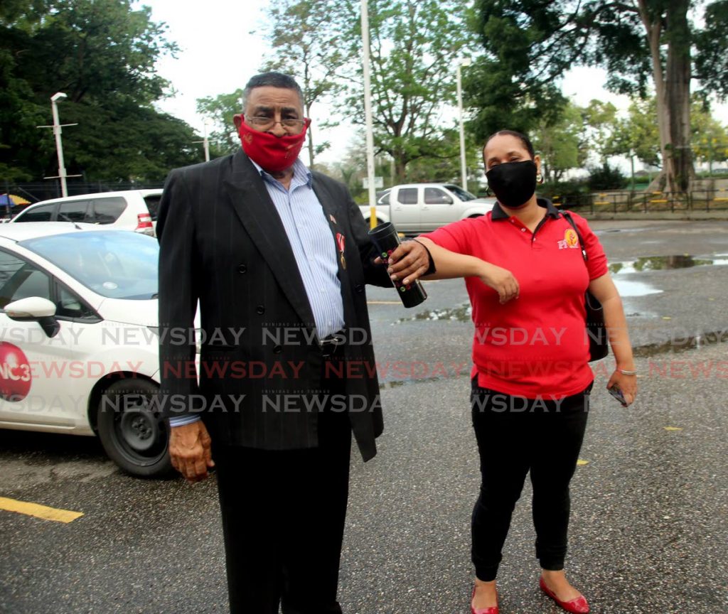 Terry Rondon greets Arima Mayor Lisa Morris-Julian before PNM screening at Queen's Hall, Port of Spain, on Sunday. - SUREASH CHOLAI