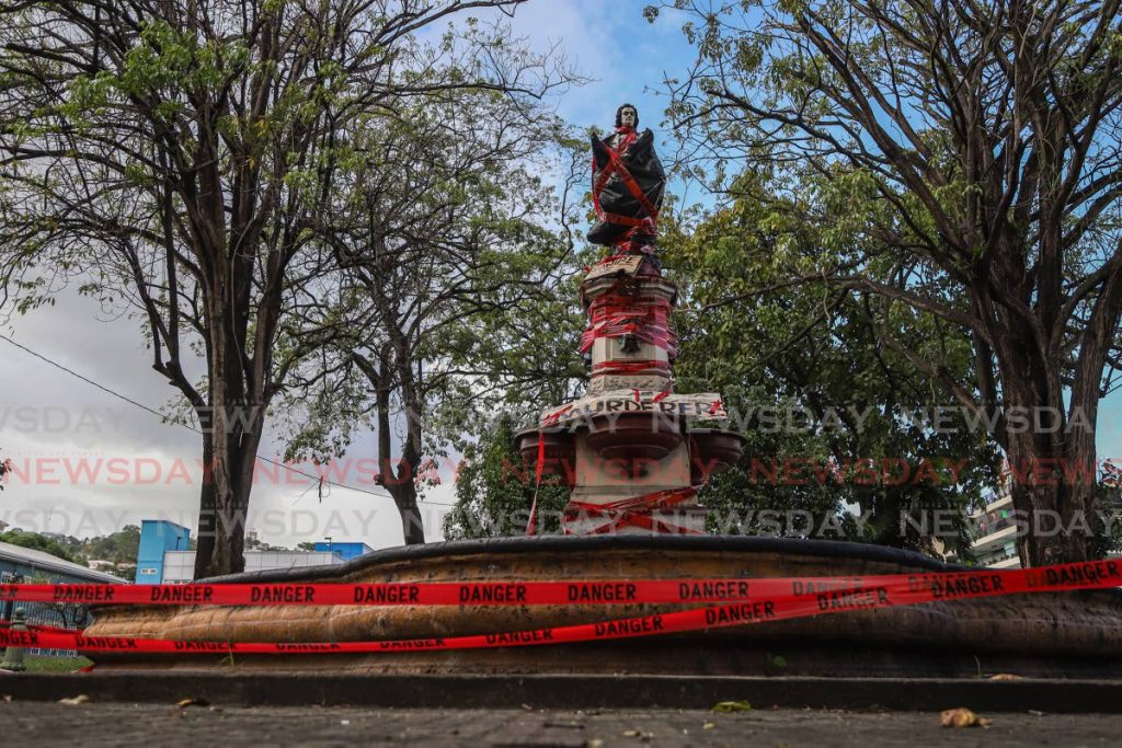 The statue of Christopher Columbus in Port of Spain after it was defaced on Monday. - JEFF K MAYERS