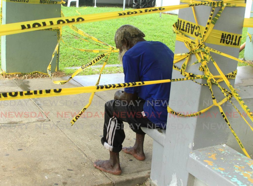 This man found himself between the caution tape to have a seat at the Arima Health Care Facility - Ayanna Kinsale