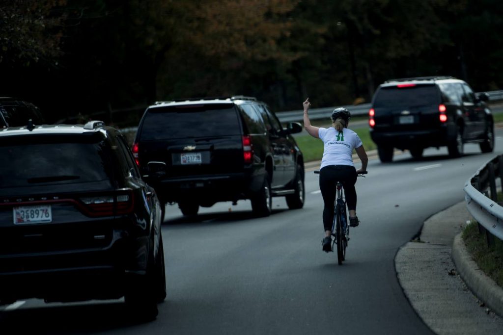In 2017, a photo of Juli Briskman making a gesture with her middle finger as a motorcade with US President Donald Trump departed the Trump National Golf Course in Sterling, Virginia went viral. Briskman subsequently lost her job lost as a marketing executive for Akima LLC, a government contracting firm. - AFP PHOTO
