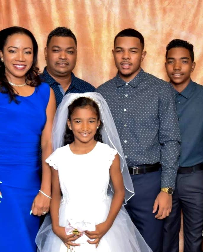 Digicel employee Roger Pedro and his family. - Roger Pedro