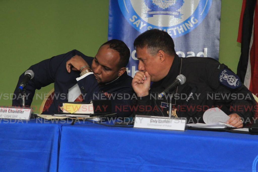 SECRET TALKS: Police Commissioner Gary Griffith, right, speaks with head of the Legal Unit, Christian Chandler, on Thursday at the weekly police press briefing. 
 - Angelo Marcelle