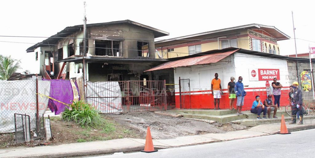 BURNT: The house in Chase Village, Chaguanas which was destroyed by fire on Saturday leaving a family of ten homeless. PHOTO BY VASHTI SINGH - Vashti Singh
