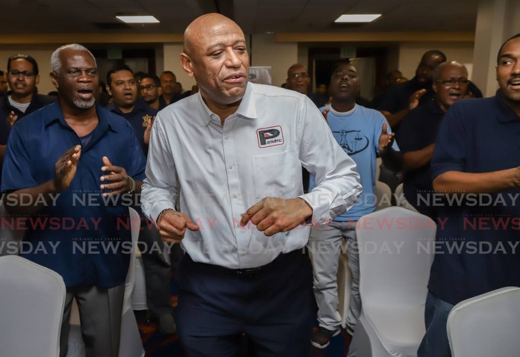 FILE PHOTO: OWTU president general Ancel Roget chants union songs with fellow comrades at the unveiling of the Patriotic Energies logo at the Radisson Hotel in Port of Spain on November 15, 2019. - JEFF K MAYERS