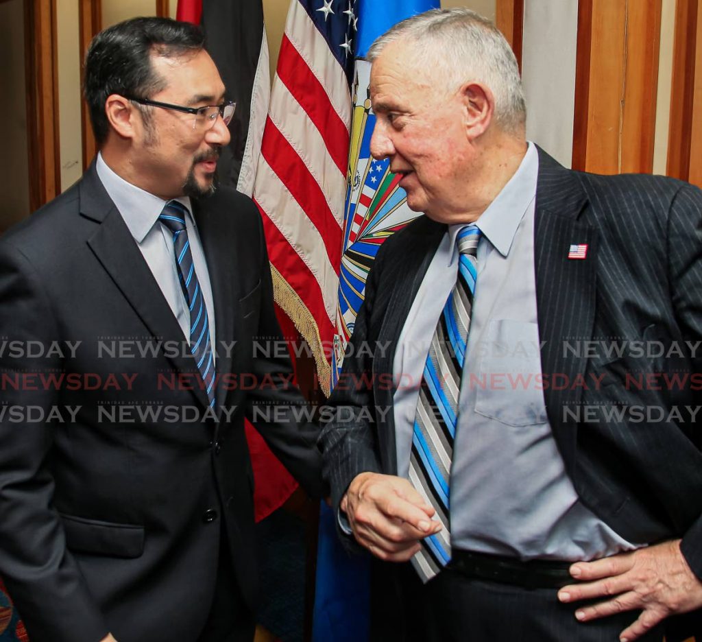 In this October 2018 file photo, National Security Minister Stuart Young talks with US Ambassador Joseph Mondello at a workshop in Hilton Trinidad, Port of Spain. Young on Saturday said the US Embassy confirmed a new immigration rule on foreign students having to leave the US applies to those whose programmes are online. - File Photo 