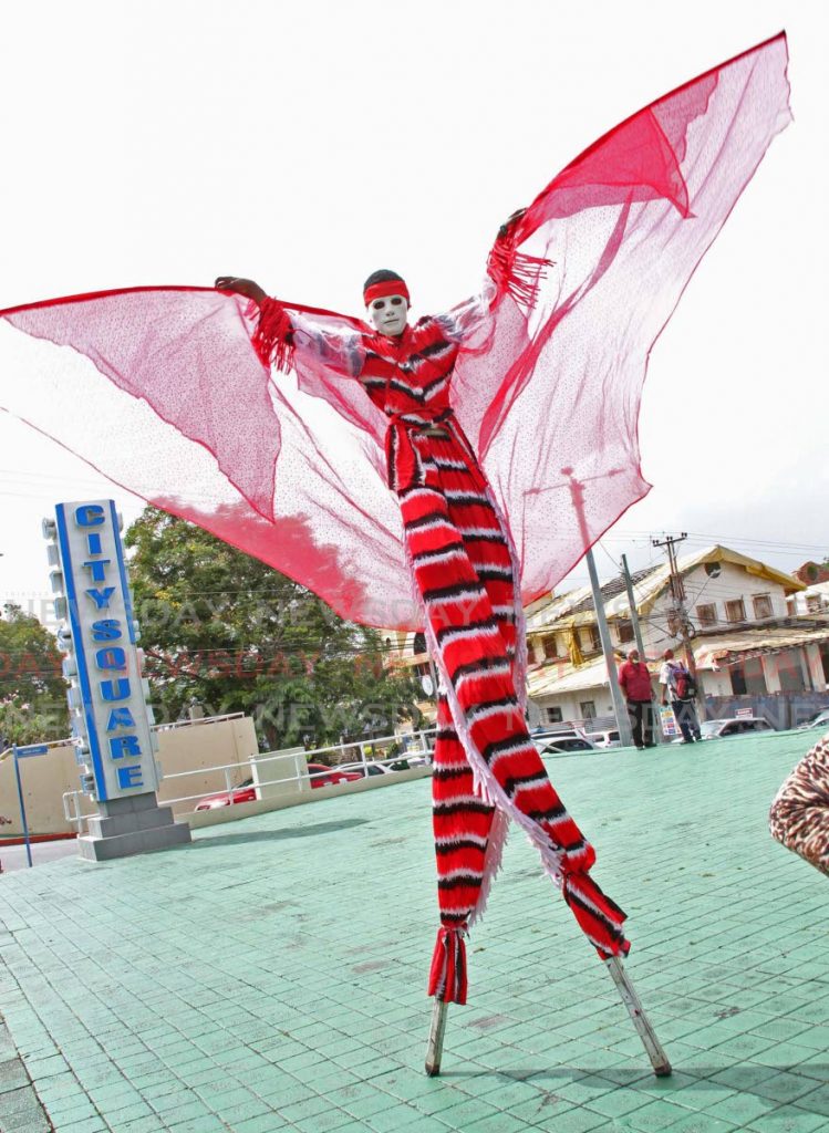  A moko jumbie shows his skill on the stilts on Harris Promenade, San Fernando.  - Vashti Singh