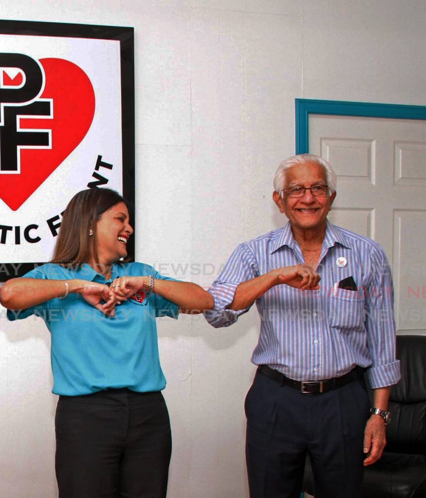 FAMILY AFFAIR: Political leader of the fledgling Patriotic Front party Mikela Panday, touches elbows with her father and the party's general election campaign manager Basdeo Panday at a press conference Thursday when it was announced that the party will contest all 41 seats in the election. PHOTO BY VASHTI SINGH - 