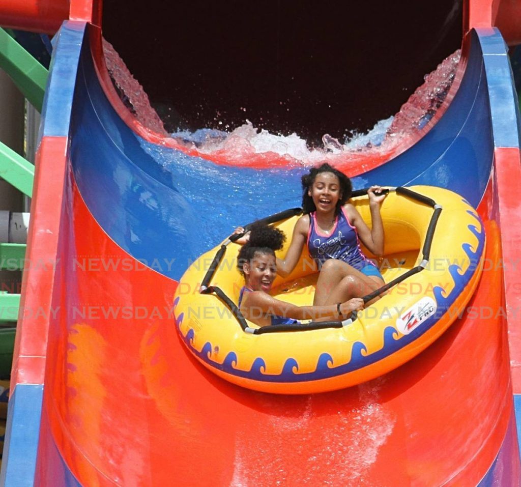 Jayley, 14 and Azalea 12, ride a water slide at the water park. - Angelo M. Marcelle
